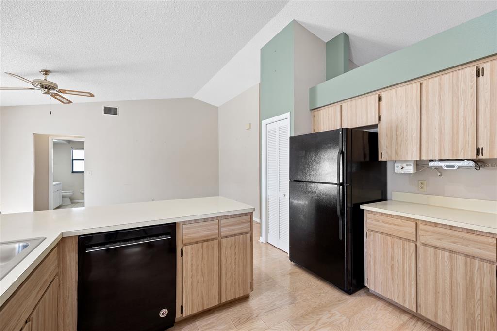 8352 Natoma Street Spring Hill, FL 34606 - Photo 15 of 48 a kitchen with stainless steel appliances a refrigerator and a sink