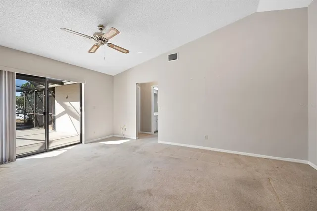 wooden floor in an empty room and a bathroom