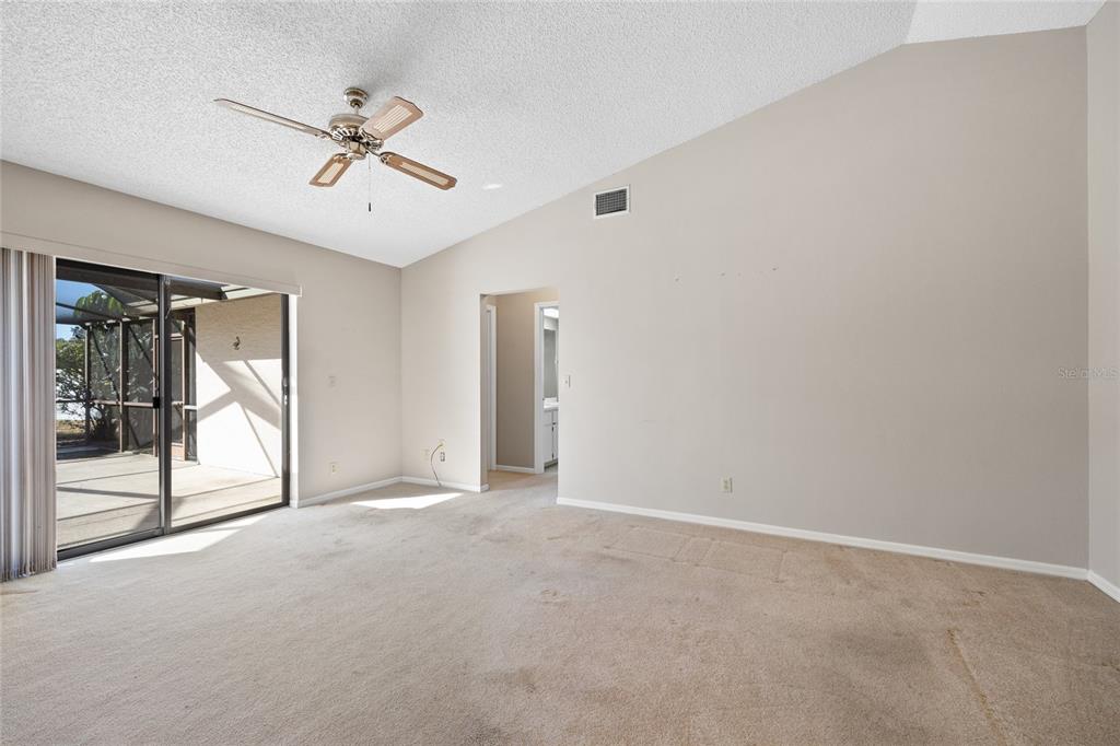 8352 Natoma Street Spring Hill, FL 34606 - Photo 18 of 48 a view of a livingroom with a ceiling fan and window