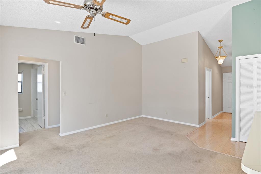 8352 Natoma Street Spring Hill, FL 34606 - Photo 19 of 48 wooden floor in an empty room and a bathroom