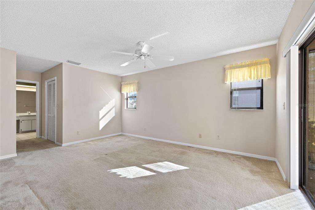 8352 Natoma Street Spring Hill, FL 34606 - Photo 20 of 48 an empty room with windows and closet