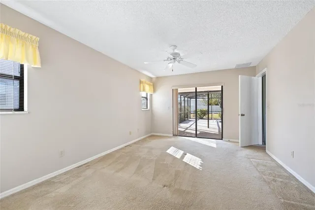a view of a hallway with bathroom and a sink