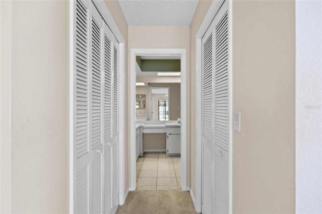 8352 Natoma Street Spring Hill, FL 34606 - Photo 22 of 48 a view of a hallway with bathroom and a sink
