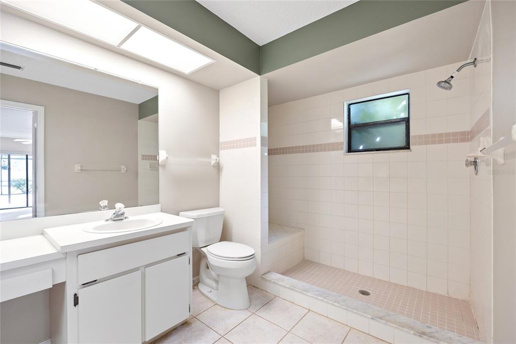 8352 Natoma Street Spring Hill, FL 34606 - Photo 25 of 48 a bathroom with a sink a toilet and shower