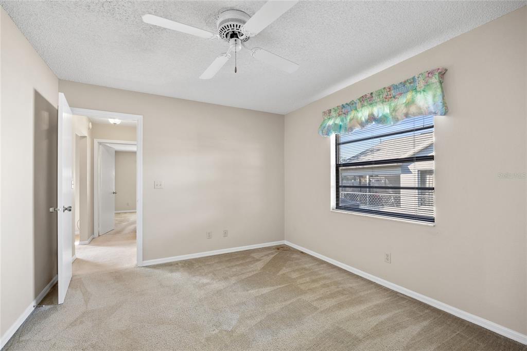 8352 Natoma Street Spring Hill, FL 34606 - Photo 30 of 48 an empty room with windows and closet