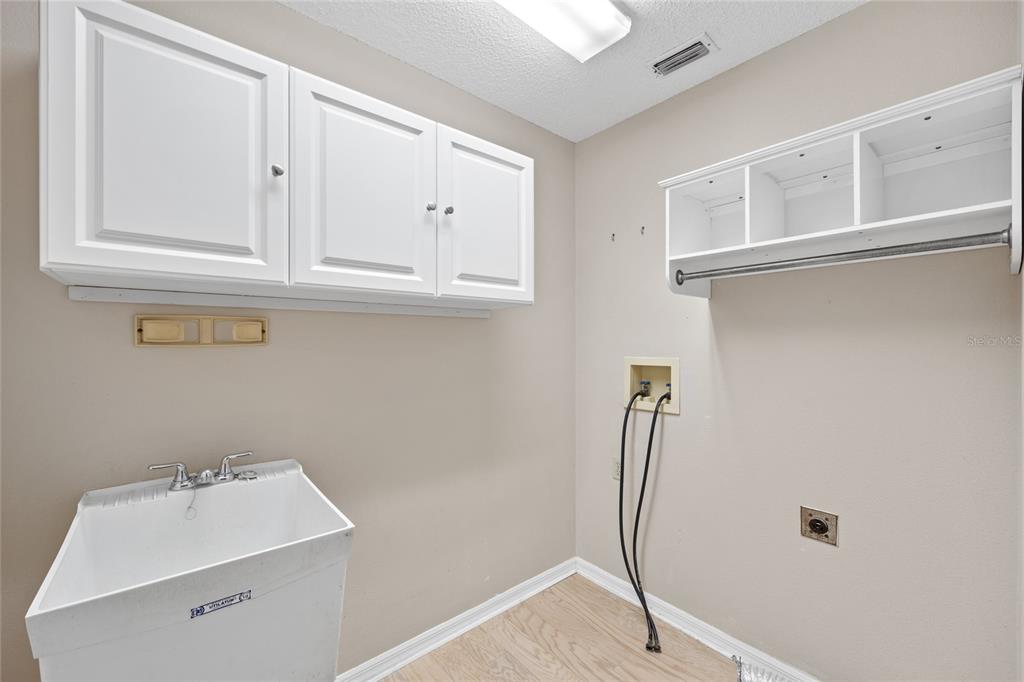 8352 Natoma Street Spring Hill, FL 34606 - Photo 32 of 48 a bathroom with a sink and a mirror