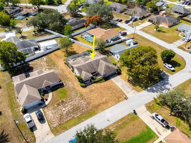 an aerial view of residential building with parking space