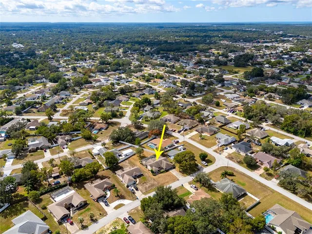 an aerial view of residential building with parking space