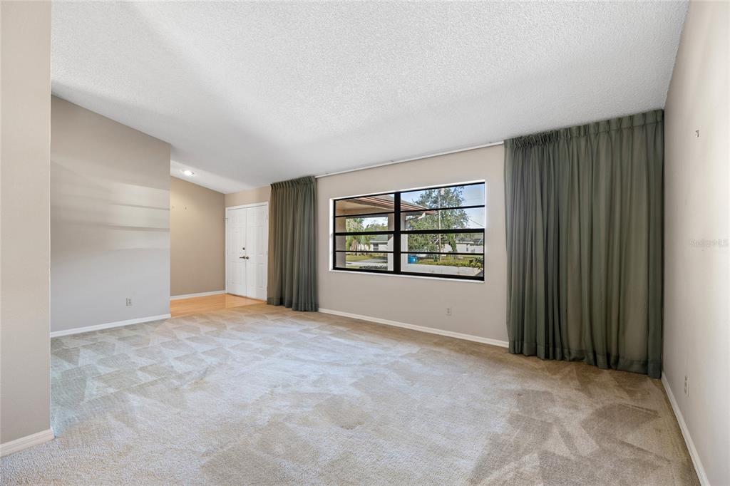8352 Natoma Street Spring Hill, FL 34606 - Photo 6 of 48 an empty room with windows