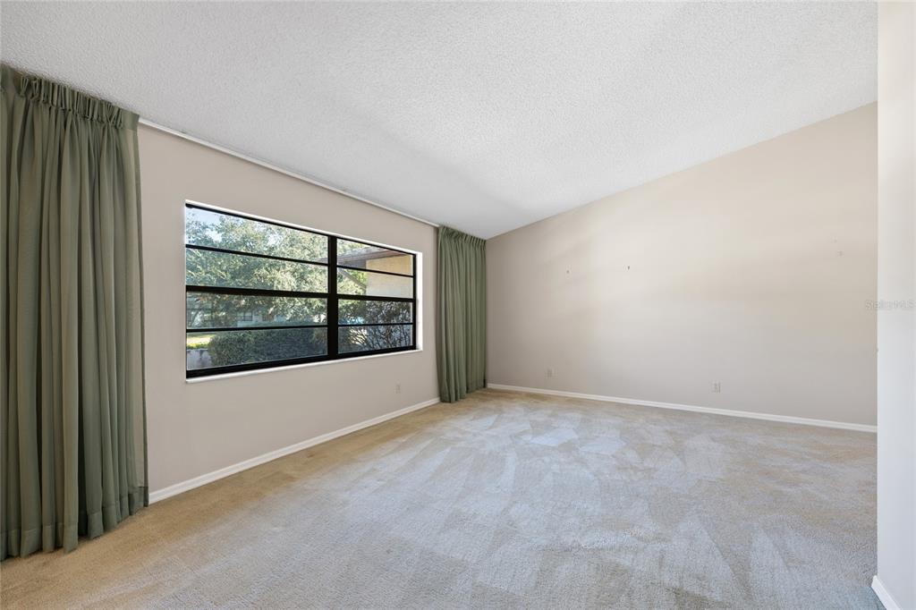 8352 Natoma Street Spring Hill, FL 34606 - Photo 7 of 48 an empty room with windows