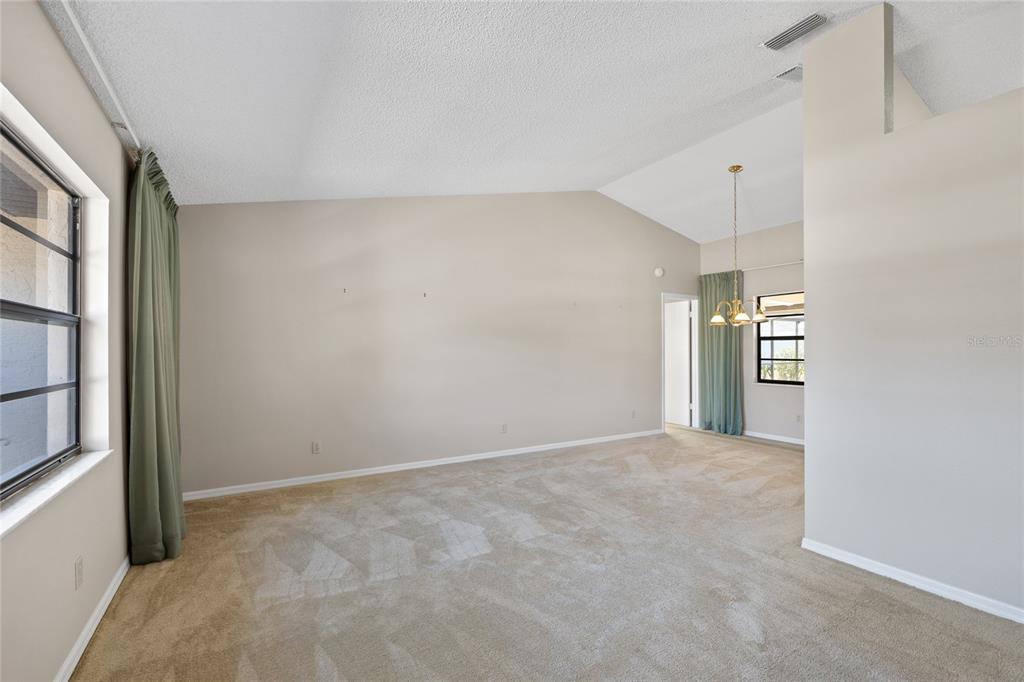 8352 Natoma Street Spring Hill, FL 34606 - Photo 8 of 48 an empty room with entrance and windows