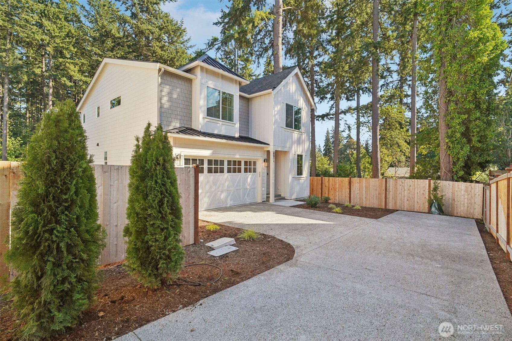 8014 222nd Street Southwest Edmonds, WA 98026 - Photo 29 of 29 a front view of a house with a yard and garage