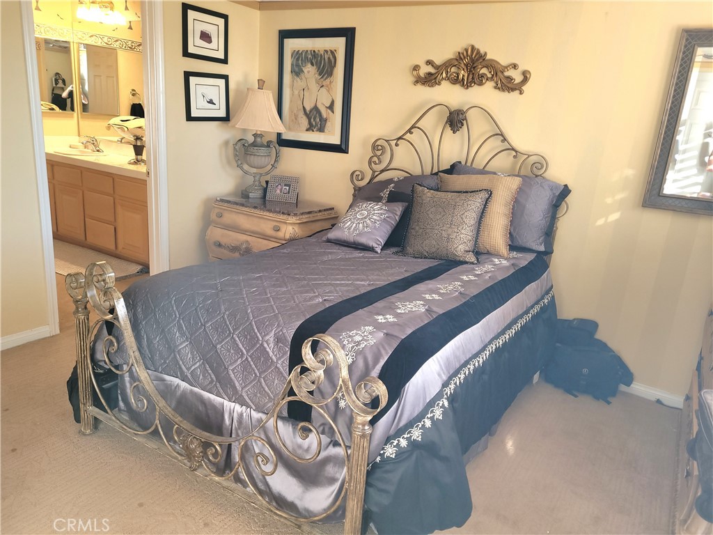 14119 Ashton Lane Riverside, CA 92508 - Photo 44 of 47 a bedroom with a bed and painting on the wall