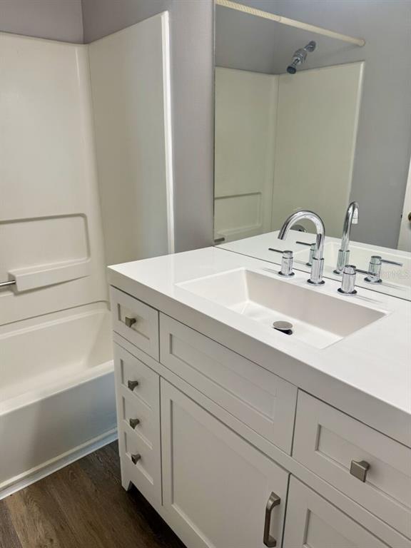 711 Sugar Bay Way, Unit 313 Lake Mary, FL 32746 - Photo 11 of 25 a bathroom with a sink and a mirror
