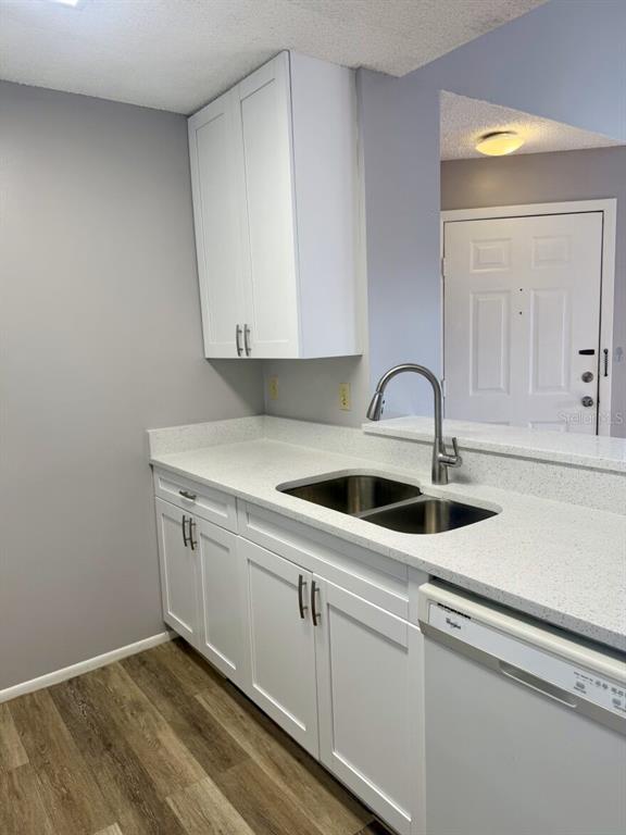 711 Sugar Bay Way, Unit 313 Lake Mary, FL 32746 - Photo 12 of 25 a kitchen with a sink and cabinets