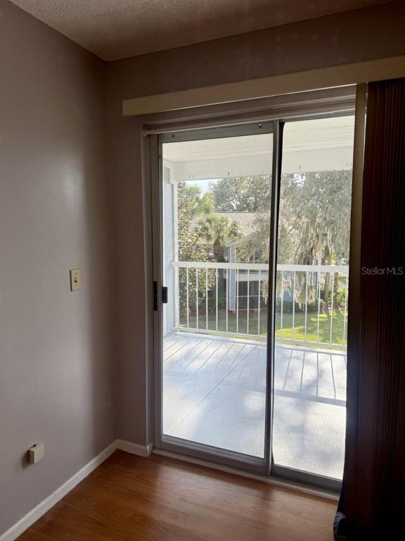 711 Sugar Bay Way, Unit 313 Lake Mary, FL 32746 - Photo 13 of 25 a view of a room with wooden floor and door