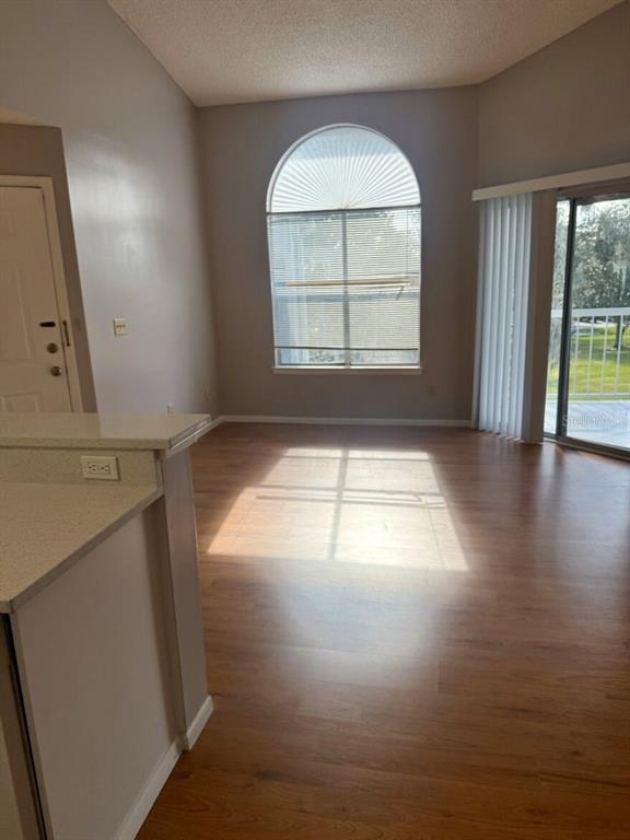 711 Sugar Bay Way, Unit 313 Lake Mary, FL 32746 - Photo 20 of 25 an empty room with wooden floor and windows