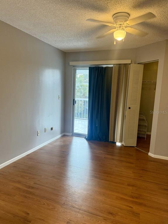 711 Sugar Bay Way, Unit 313 Lake Mary, FL 32746 - Photo 22 of 25 an empty room with wooden floor and windows