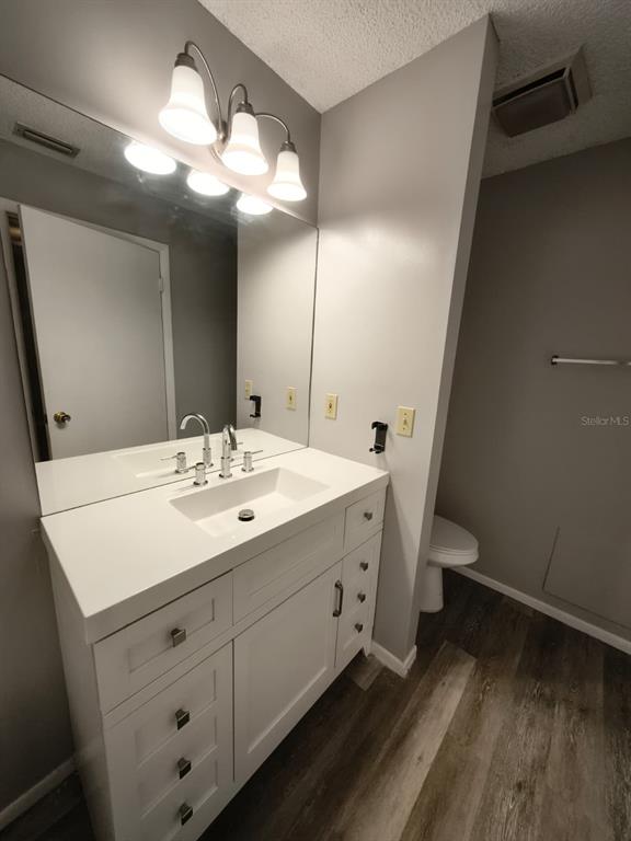 711 Sugar Bay Way, Unit 313 Lake Mary, FL 32746 - Photo 7 of 25 a bathroom with a sink and a mirror