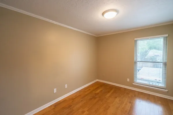 a bathroom with a granite countertop sink toilet a mirror and shower