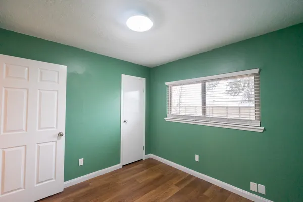 a view of room with window and entryway