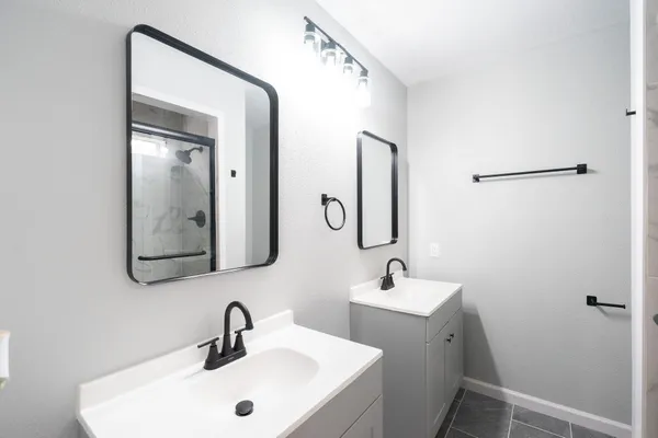 a bathroom with a glass shower door