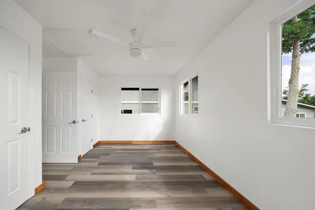 a spacious bedroom with a bed and a window