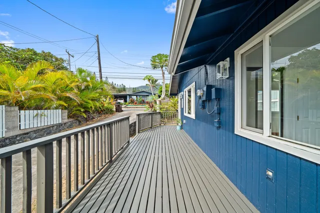 a view of a balcony with wooden floor