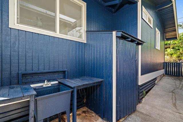 a view of a room with a table and chairs