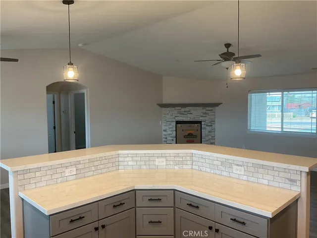 a front view of house with yard and car parked