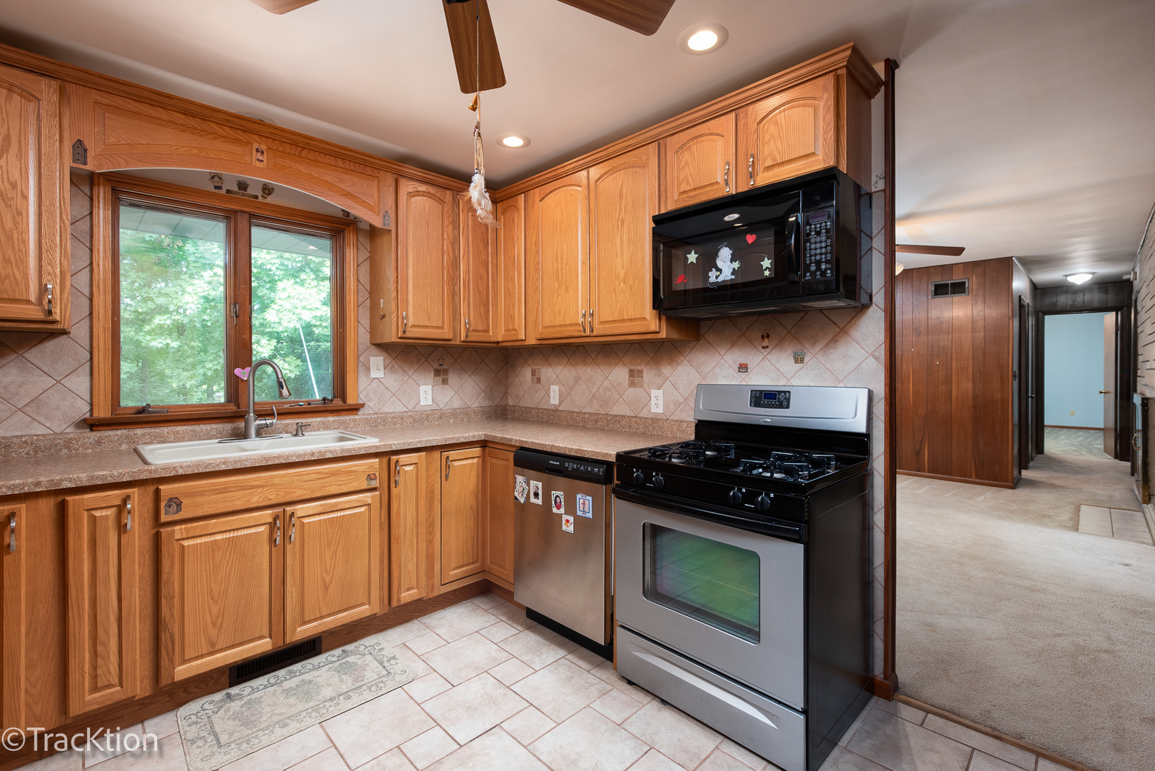 2982 Whitetie Road Morris, IL 60450 - Photo 7 of 19 a kitchen with stainless steel appliances granite countertop a stove a microwave and a sink