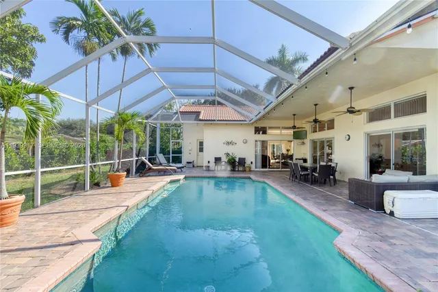 a kitchen with stainless steel appliances granite countertop a refrigerator and a stove