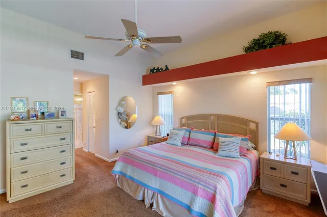a bathroom with a sink double vanity and a large mirror