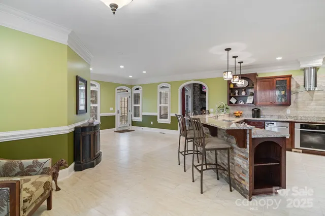 a living room with fireplace furniture and a wooden floor