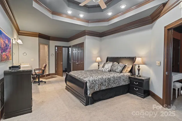 a living room with furniture and a large mirror