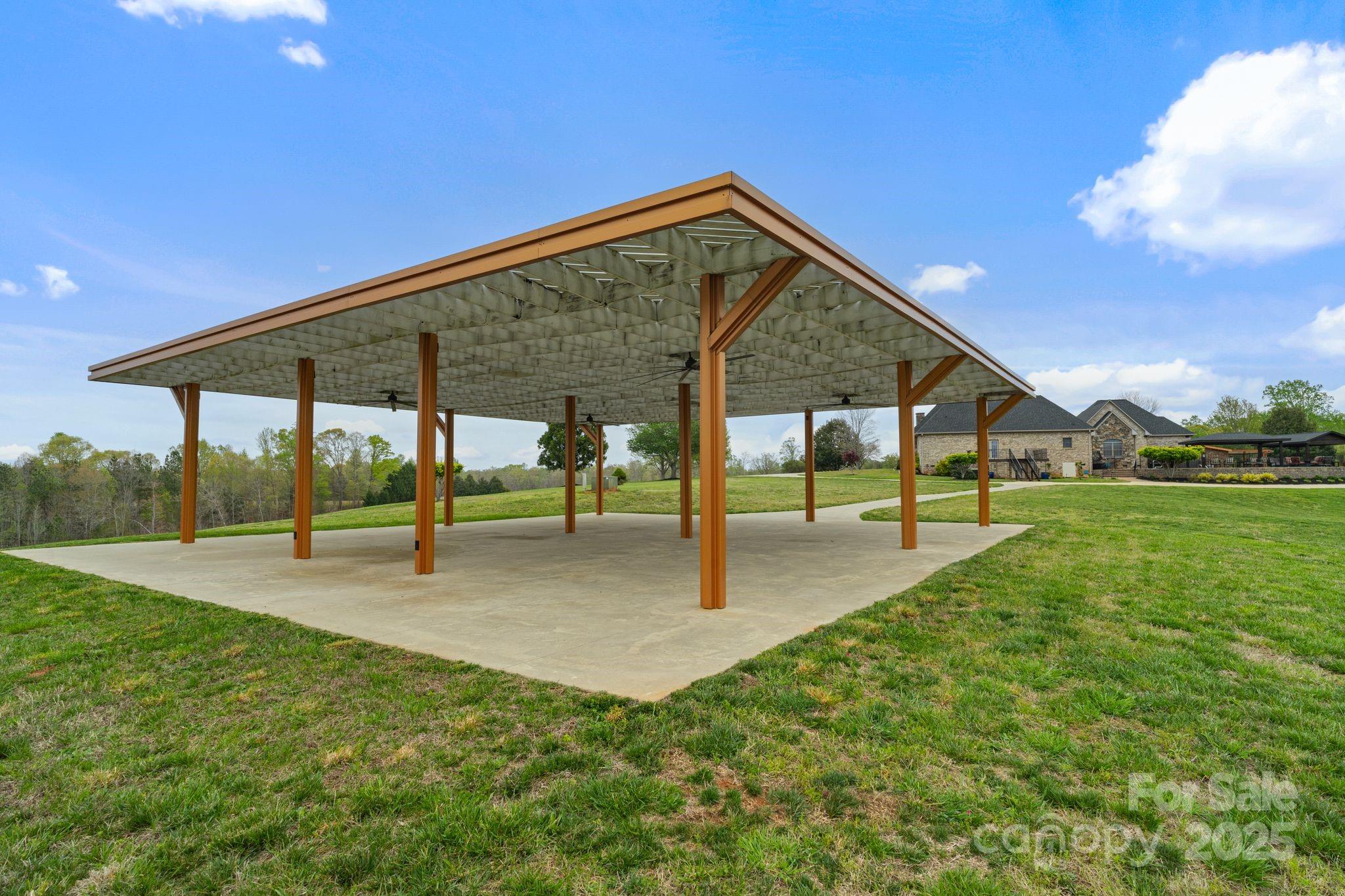 265 Philip Henderson Road Rutherfordton, NC 28139 - Photo 25 of 40 a view of an house with backyard and a patio