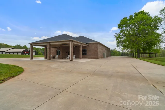 a living room with furniture and a ceiling fan