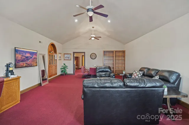 a view of a house with backyard and a tree