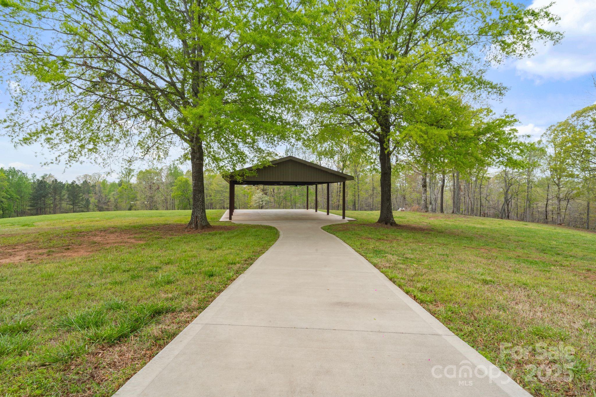 265 Philip Henderson Road Rutherfordton, NC 28139 - Photo 37 of 40 a view of a house with backyard and a tree