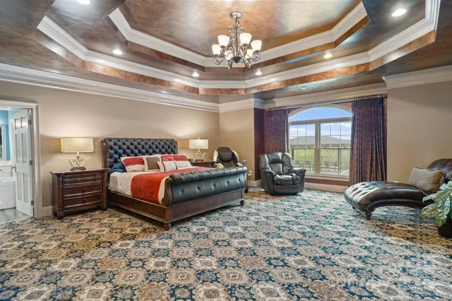 a bedroom with a bed and ceiling fan