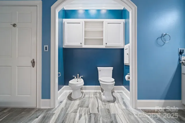 a bathroom with a sink and a toilet