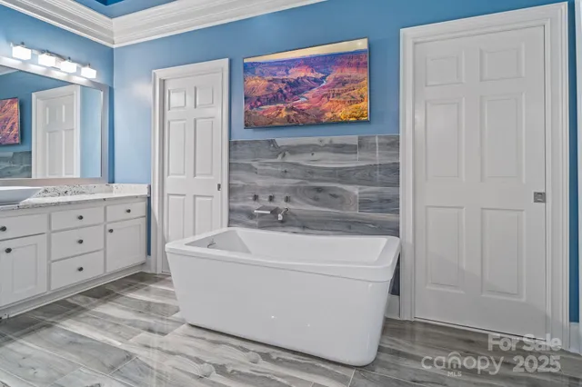 a bathroom with a sink a mirror and a bathtub