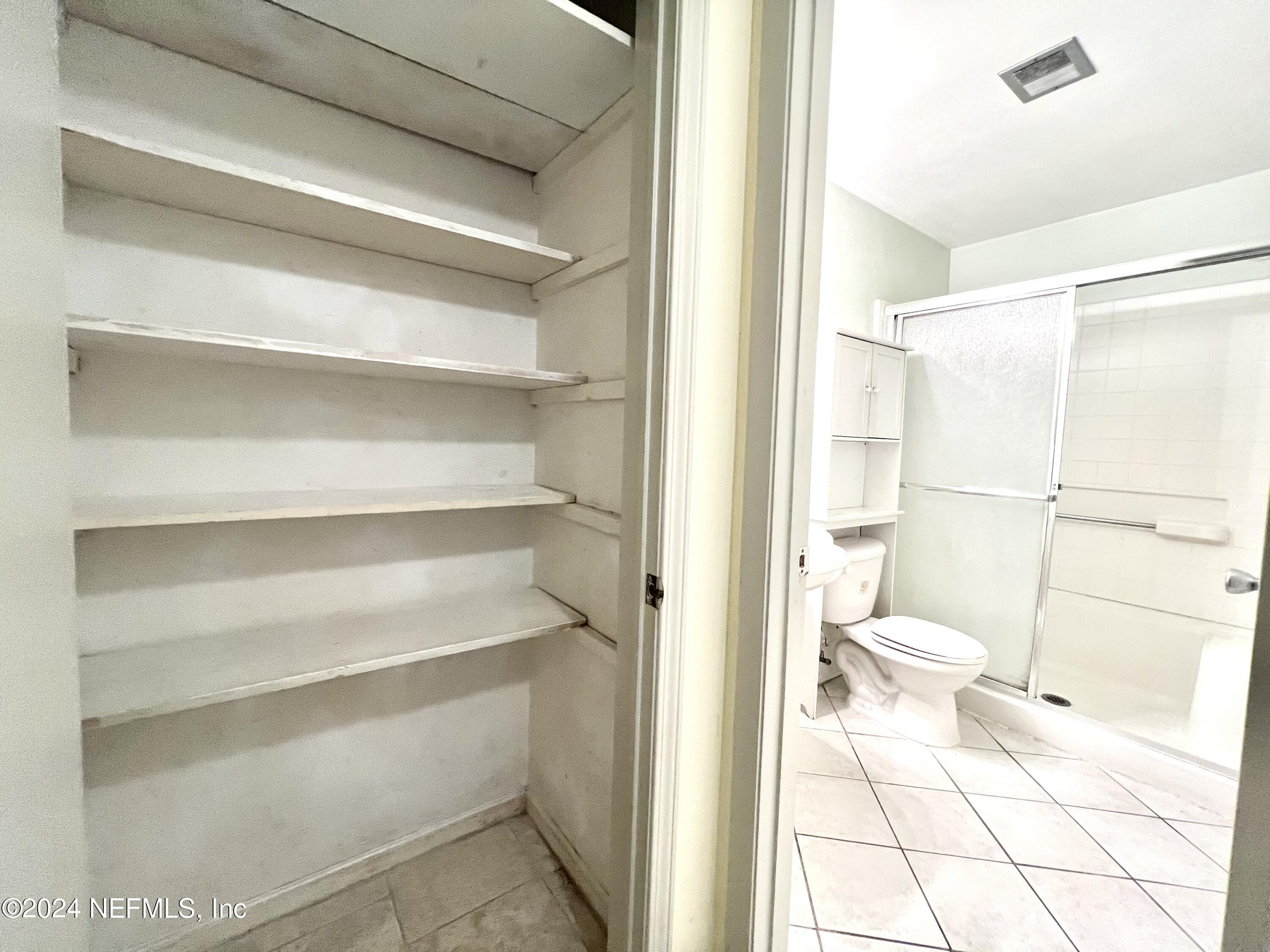 1631 El Prado Road, Unit 4 Jacksonville, FL 32216 - Photo 11 of 23 a bathroom with a toilet and a shower