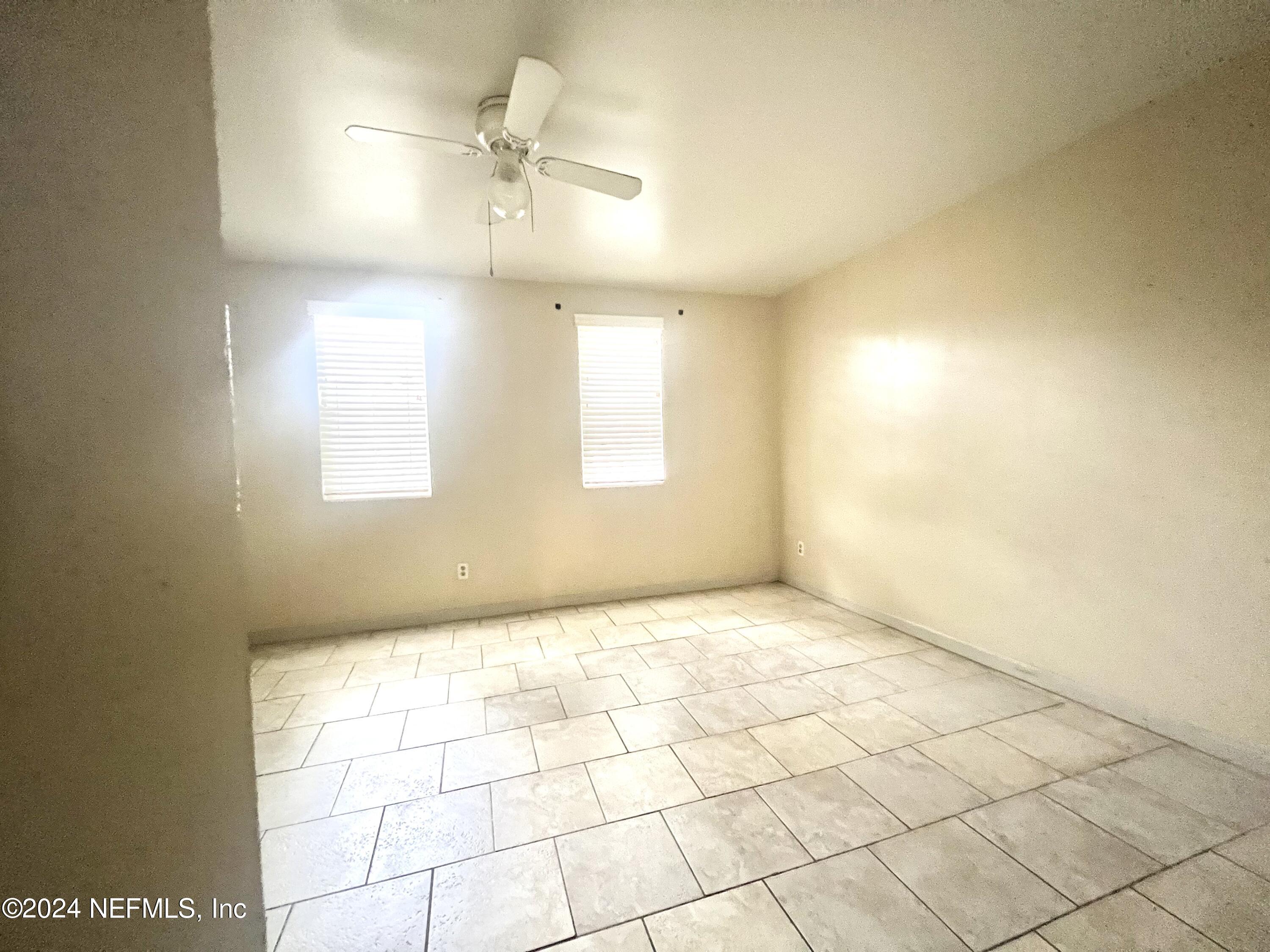 1631 El Prado Road, Unit 4 Jacksonville, FL 32216 - Photo 14 of 23 an empty room with windows and fan