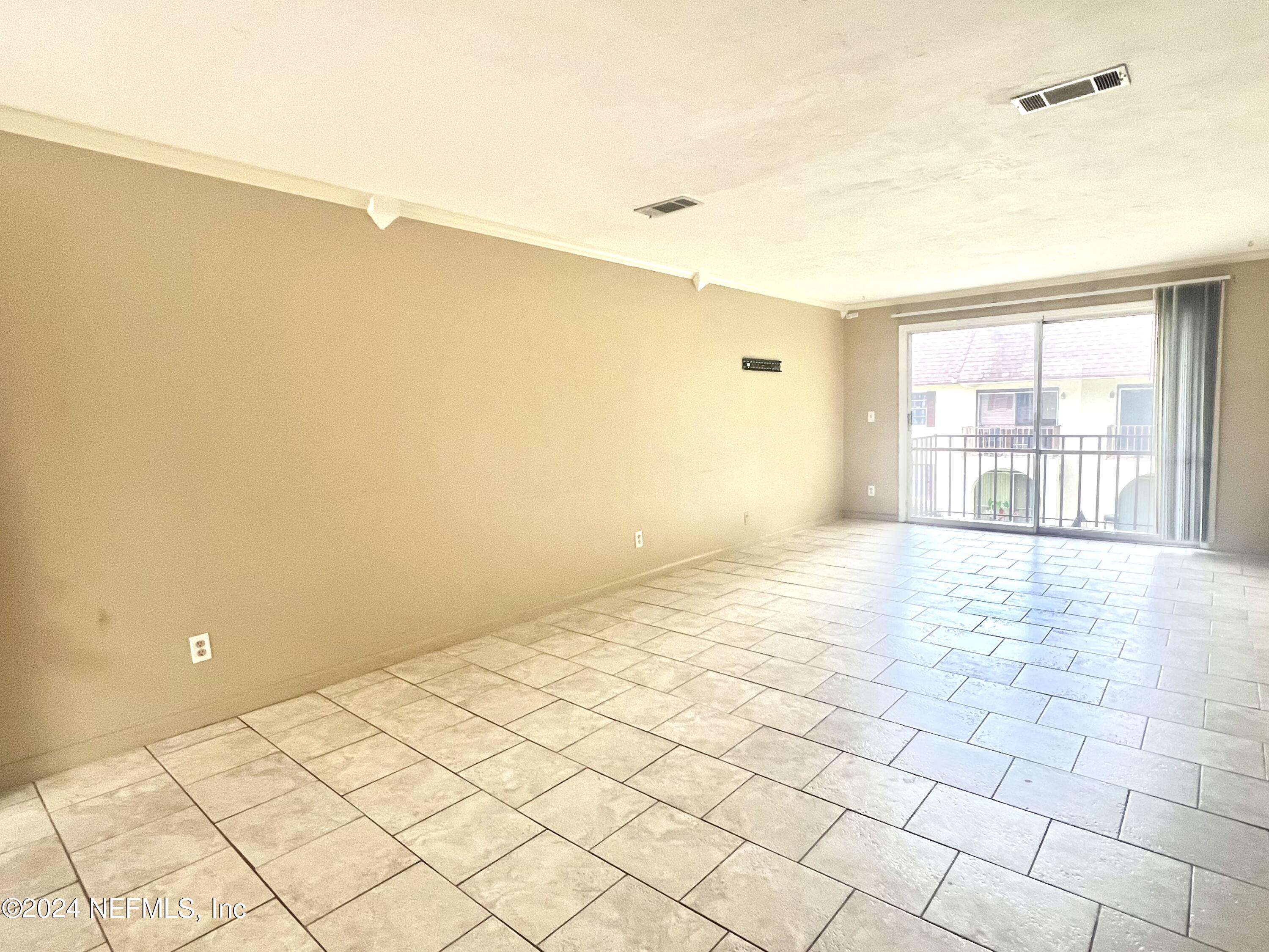 1631 El Prado Road, Unit 4 Jacksonville, FL 32216 - Photo 2 of 23 a view of an empty room and window