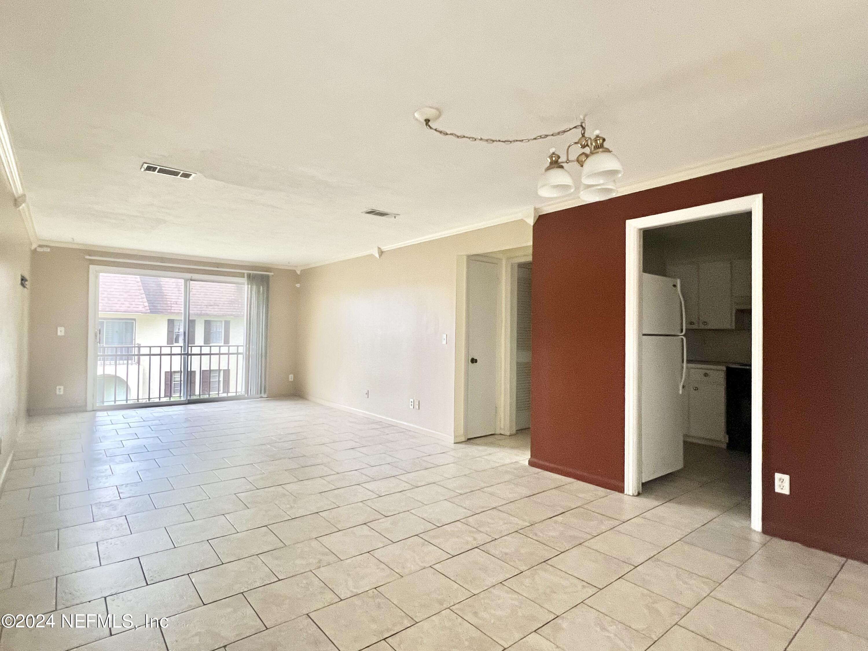 1631 El Prado Road, Unit 4 Jacksonville, FL 32216 - Photo 3 of 23 a view of an empty room with a window