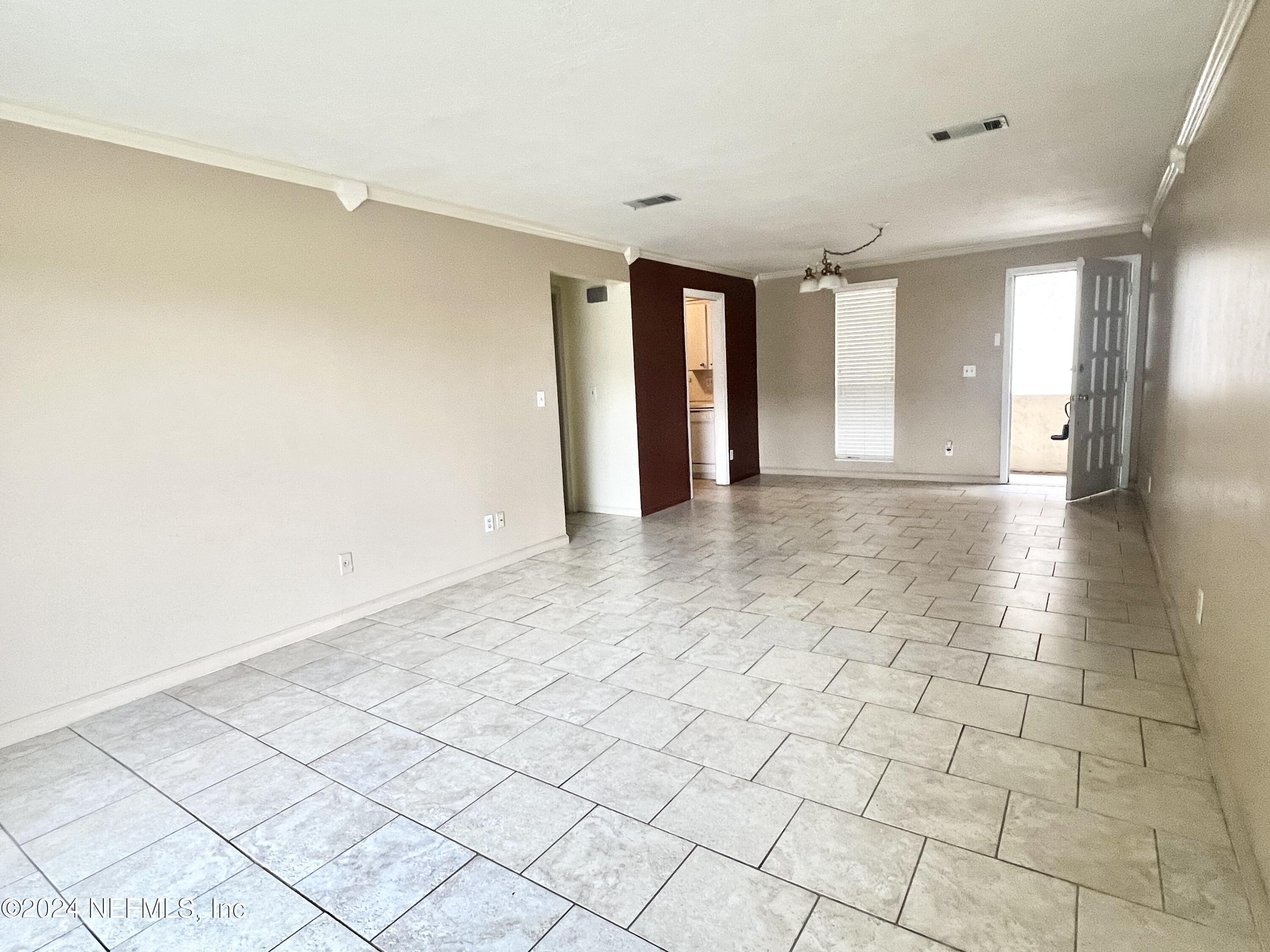 1631 El Prado Road, Unit 4 Jacksonville, FL 32216 - Photo 4 of 23 a view of an empty room and window