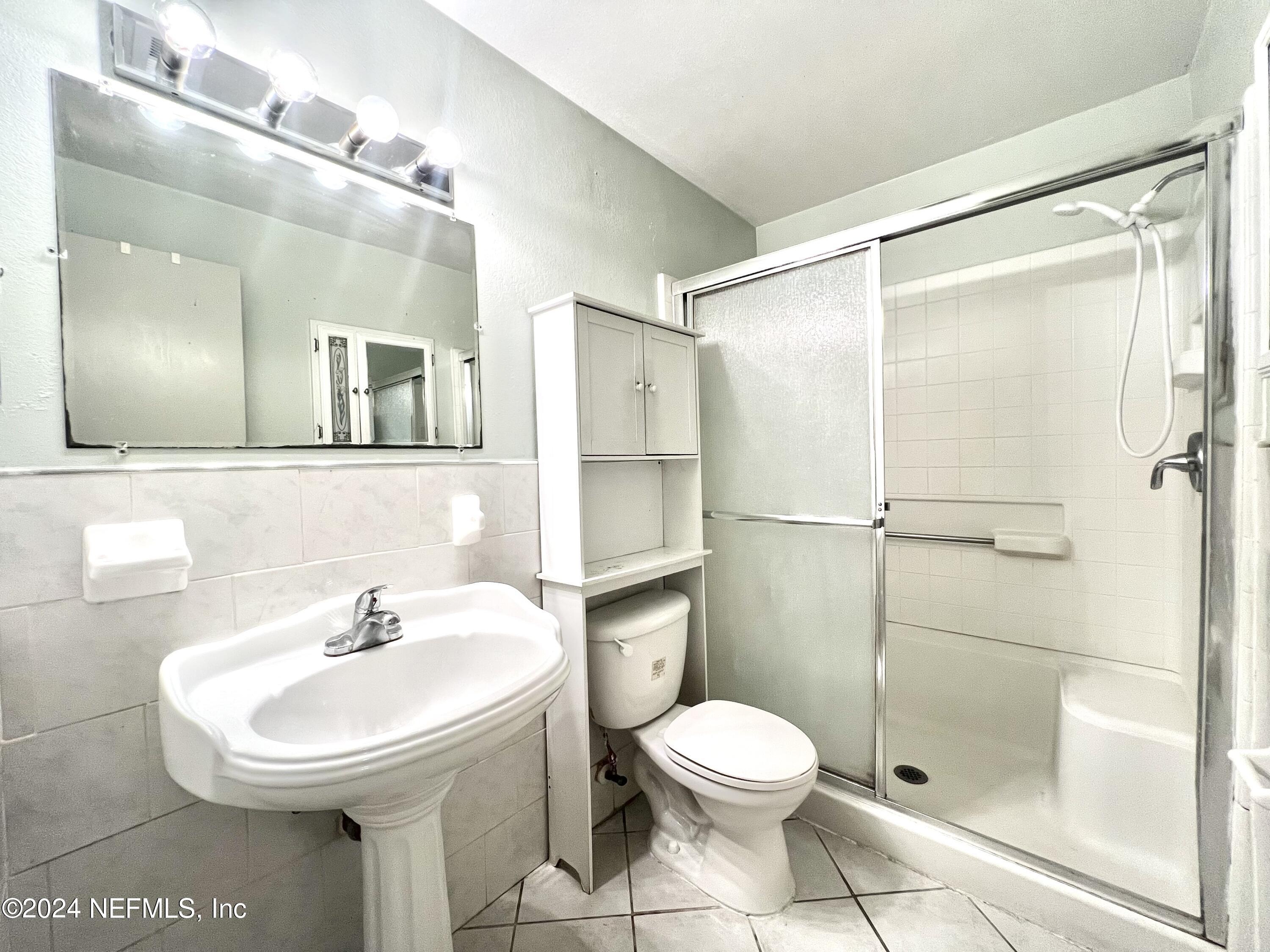 1631 El Prado Road, Unit 4 Jacksonville, FL 32216 - Photo 8 of 23 a bathroom with a sink toilet and shower
