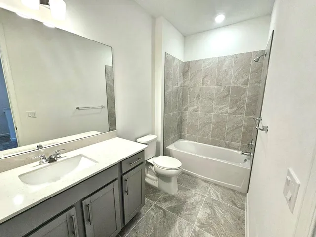 a view of a bathroom from the hallway