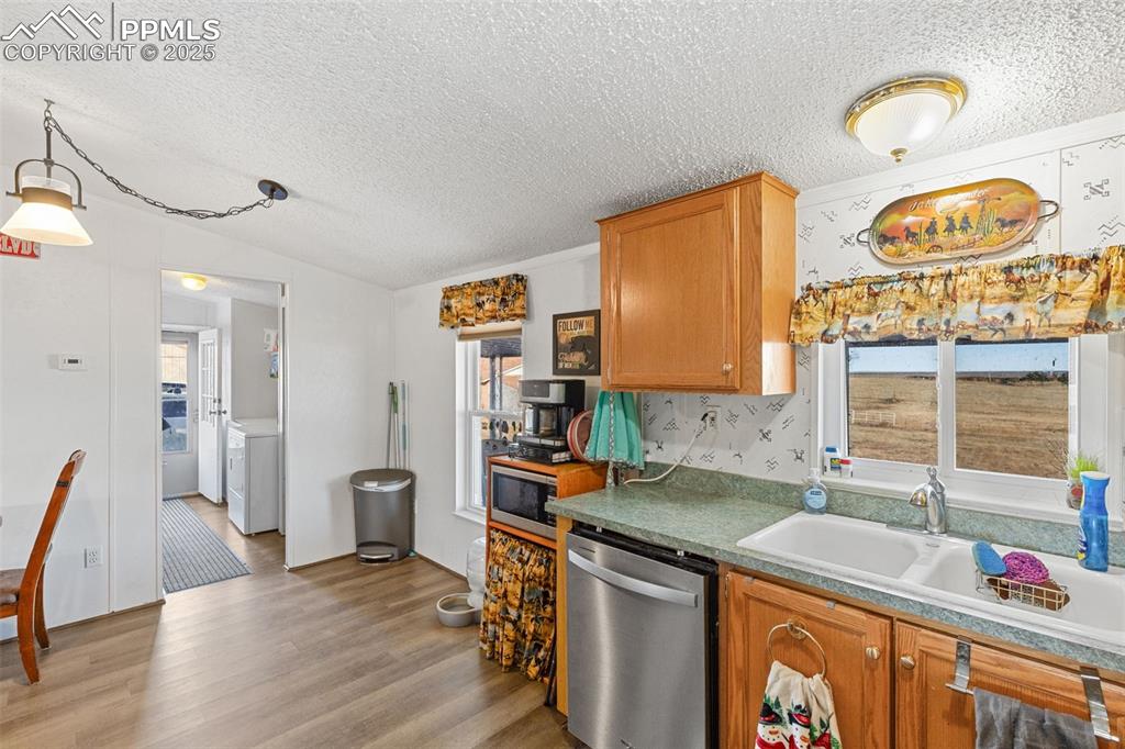20480 Drennan Road Colorado Springs, CO 80928 - Photo 19 of 47 a kitchen that has a sink and a stove